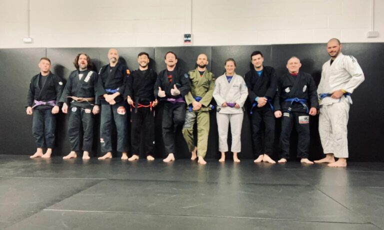 Students practise Brazilian jiu-jitsu together during class.