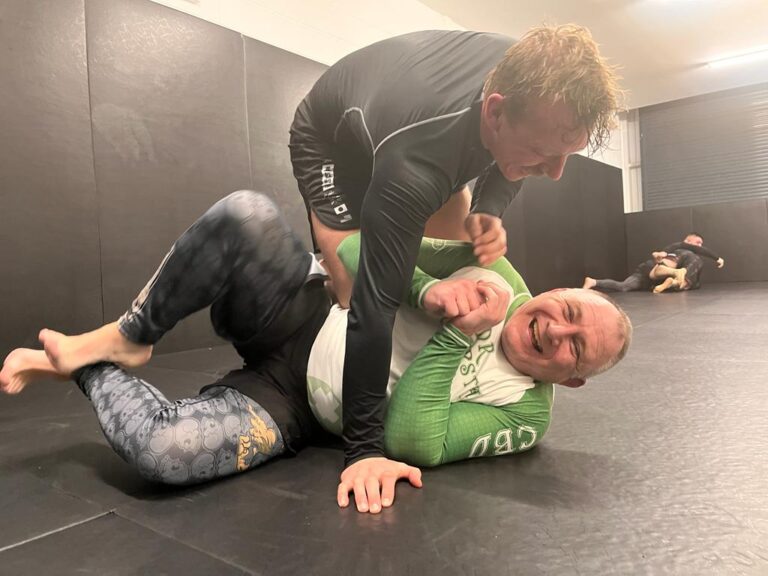 Students work through a close-range grappling drill.