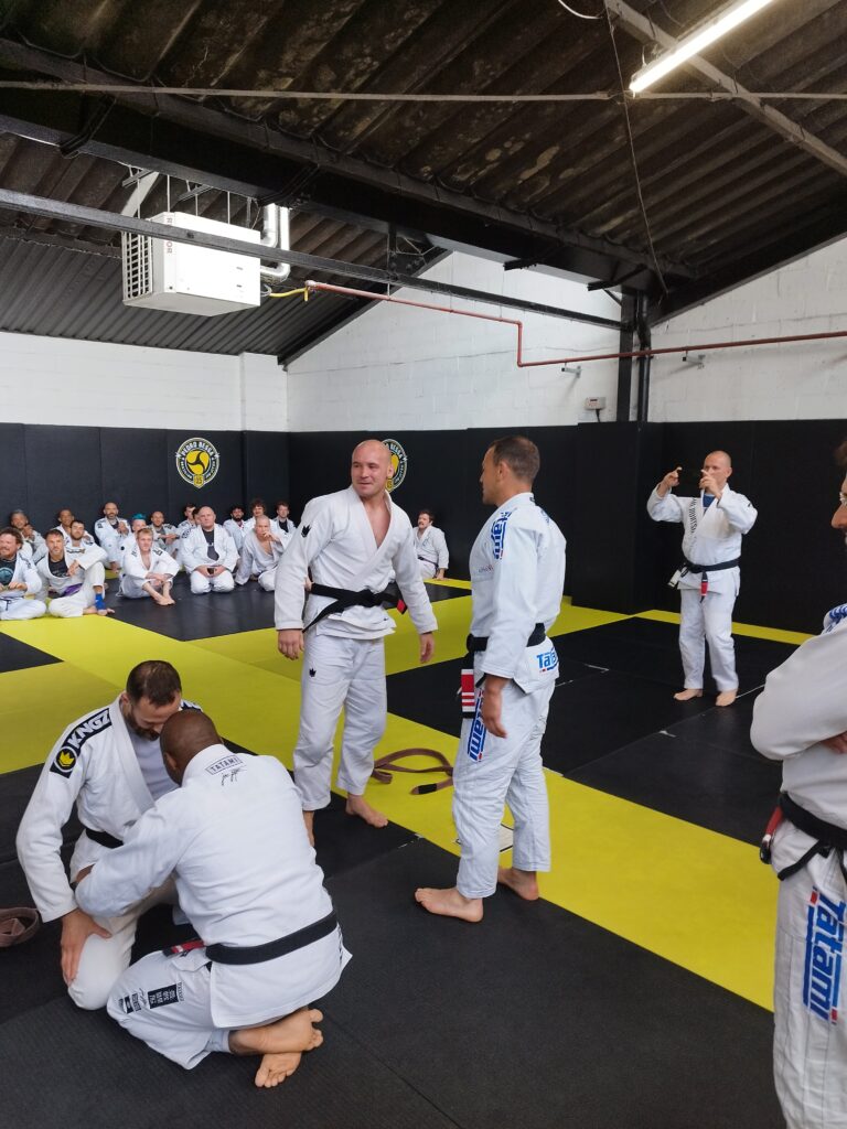 Students gather on the mat for a Brazilian jiu-jitsu lesson.