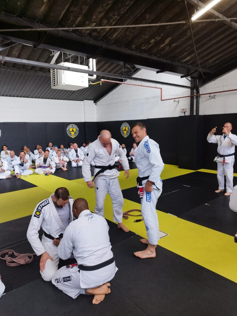 Students practise jiu-jitsu during a group training session.