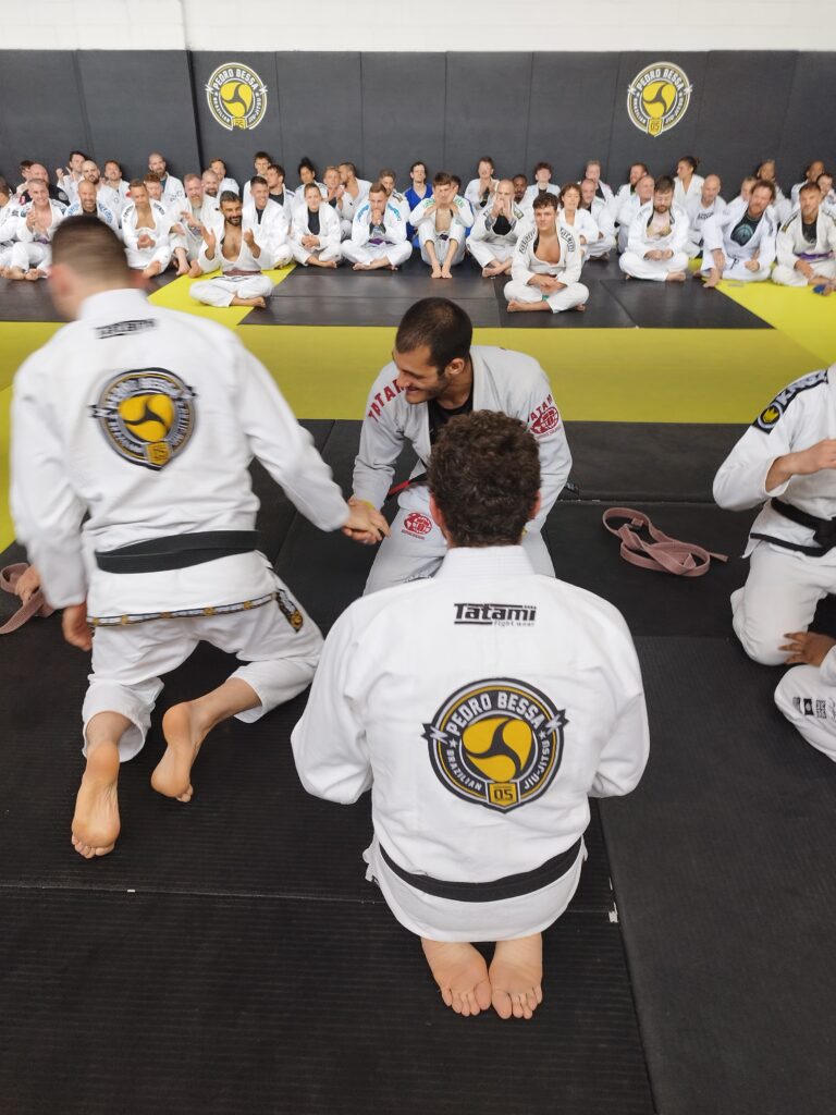 Students attend a Brazilian jiu-jitsu seminar on the mats.