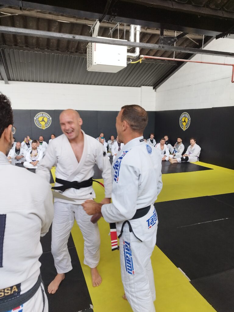 Students watch a technique demonstration during class.