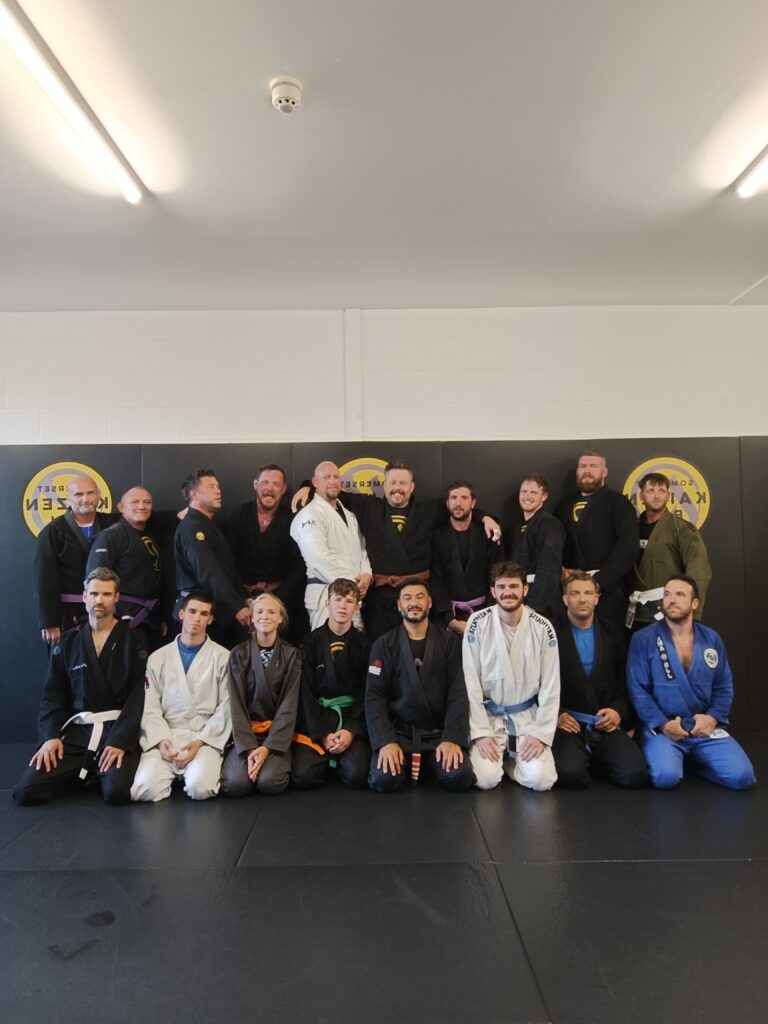 Kaizen BJJ students pose together after training.